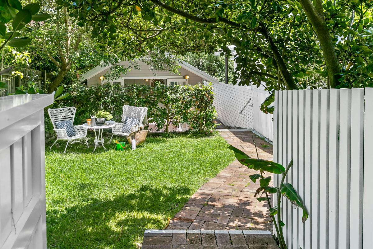 Enter from the white picket fence