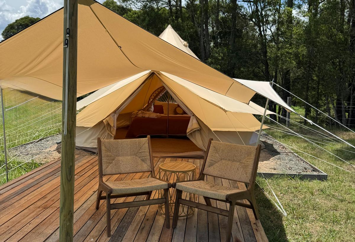 Undercover seating on the deck outside the tent.