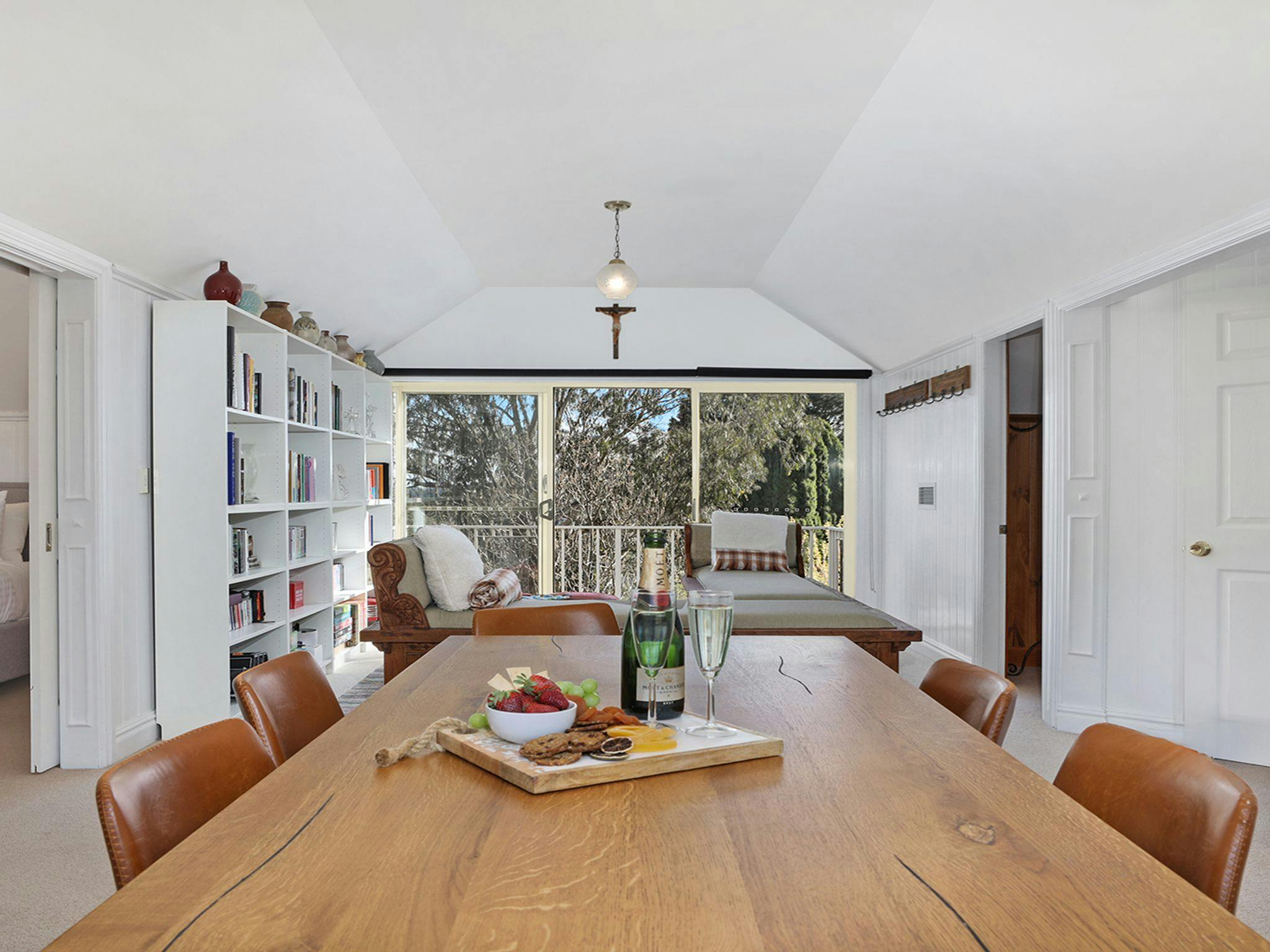 Southern Grace | Upstairs informal dining room | Book library | Balcony