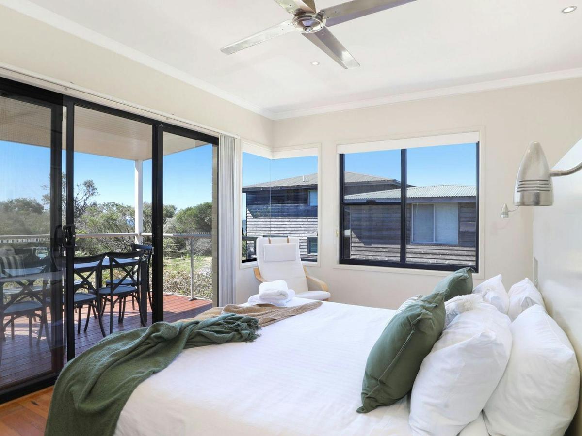 The Break | Bedroom 1 | King | Ceiling fan | Balcony access | Views