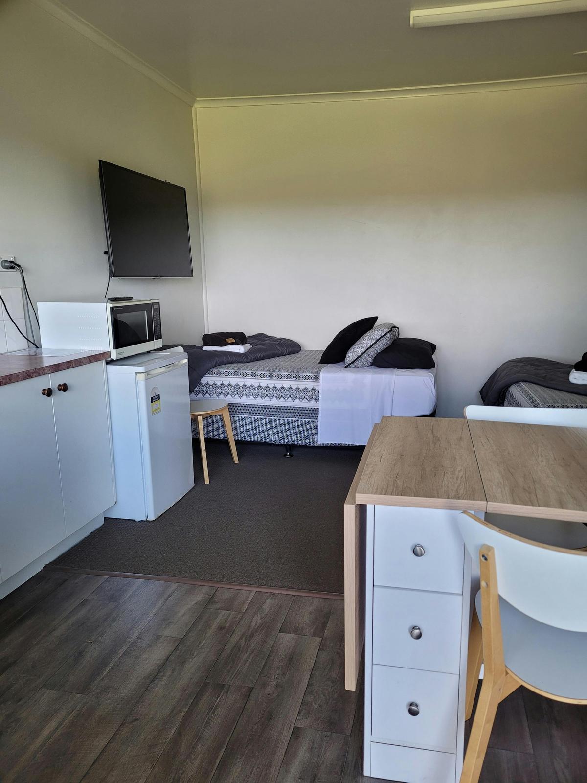 Our Triple Room on the River SideQueen bed plus King Single opening out to large grassed area