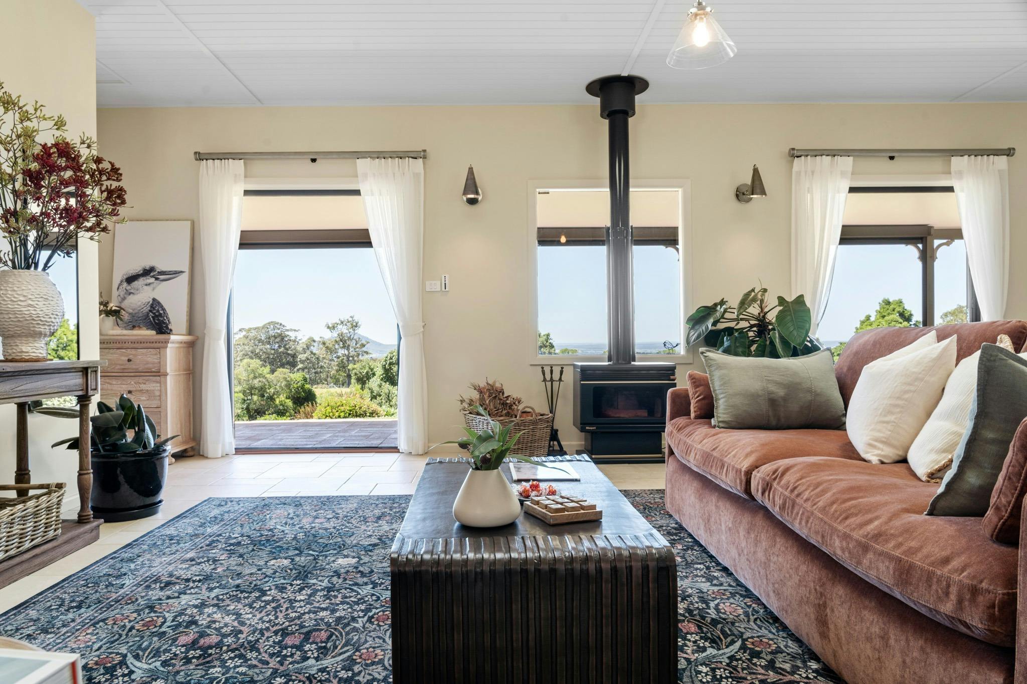 Relax in the cosy living area with plush lounge seating, curated interiors & crackling indoor fire