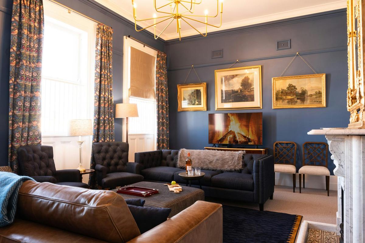 Large sitting room for friends.ds to gather  around the electric fire.