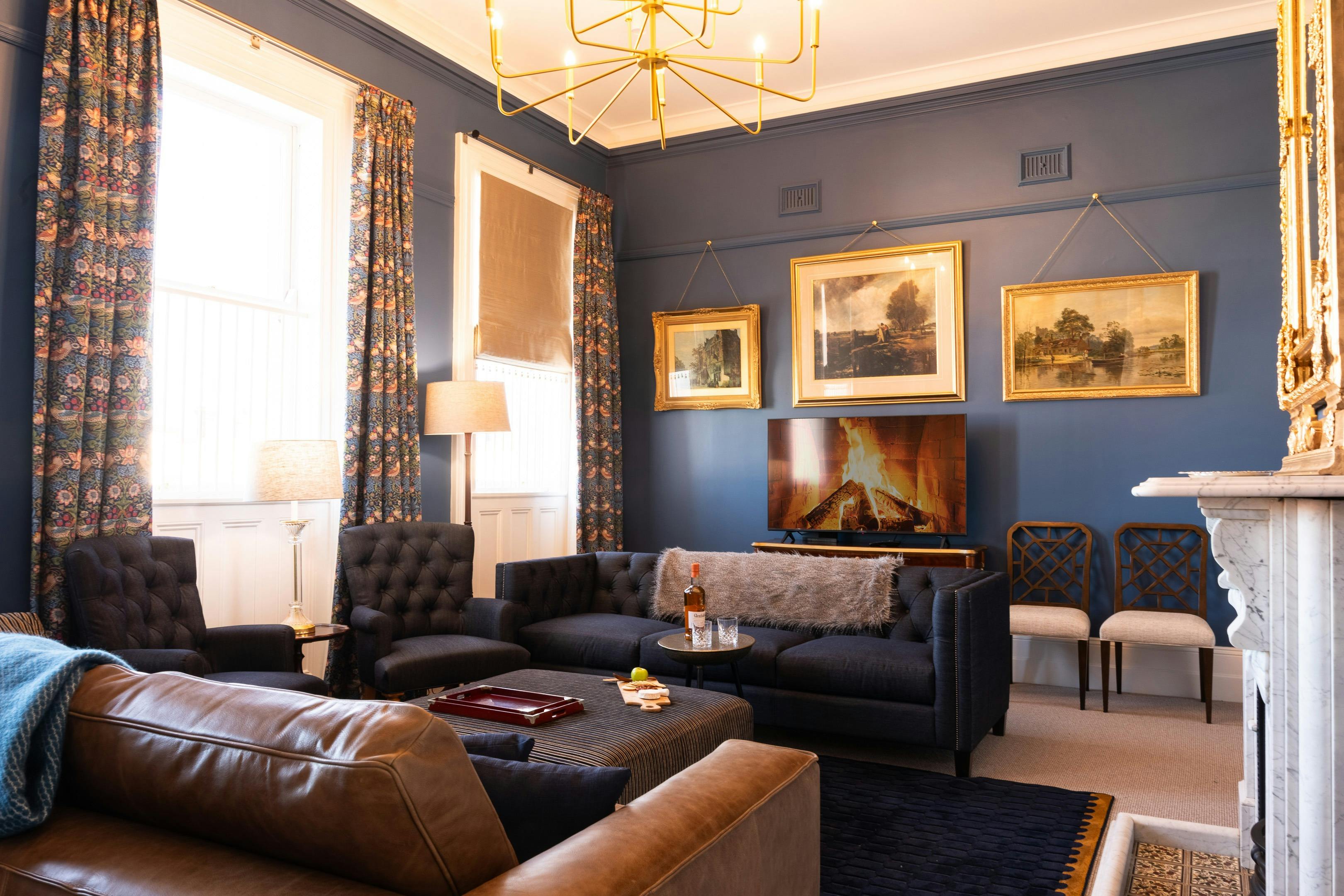 Large sitting room for friends.ds to gather  around the electric fire.