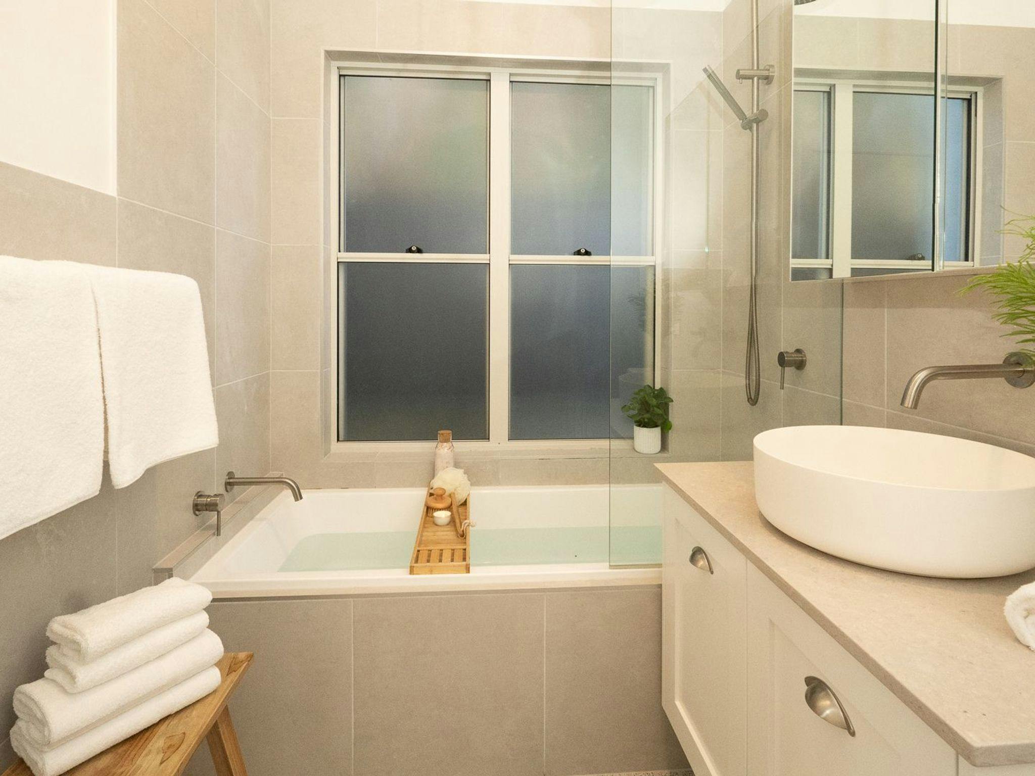 Sunshine Cottage | Bathroom | Bath | Shower | Vanity | Toilet | Bodywash | Shampoo | Conditioner