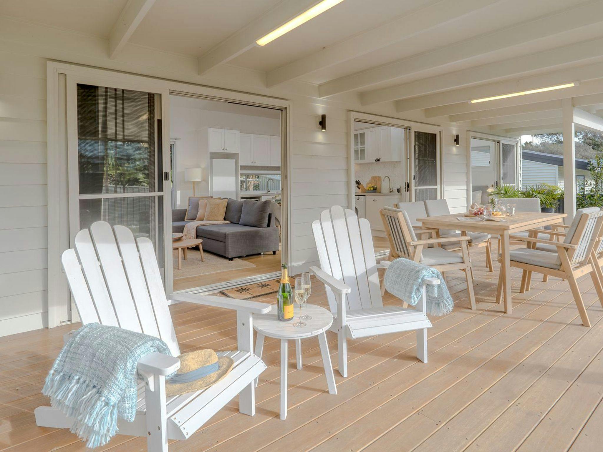 Sunshine Cottage | Covered outdoor deck | Al fresco dining