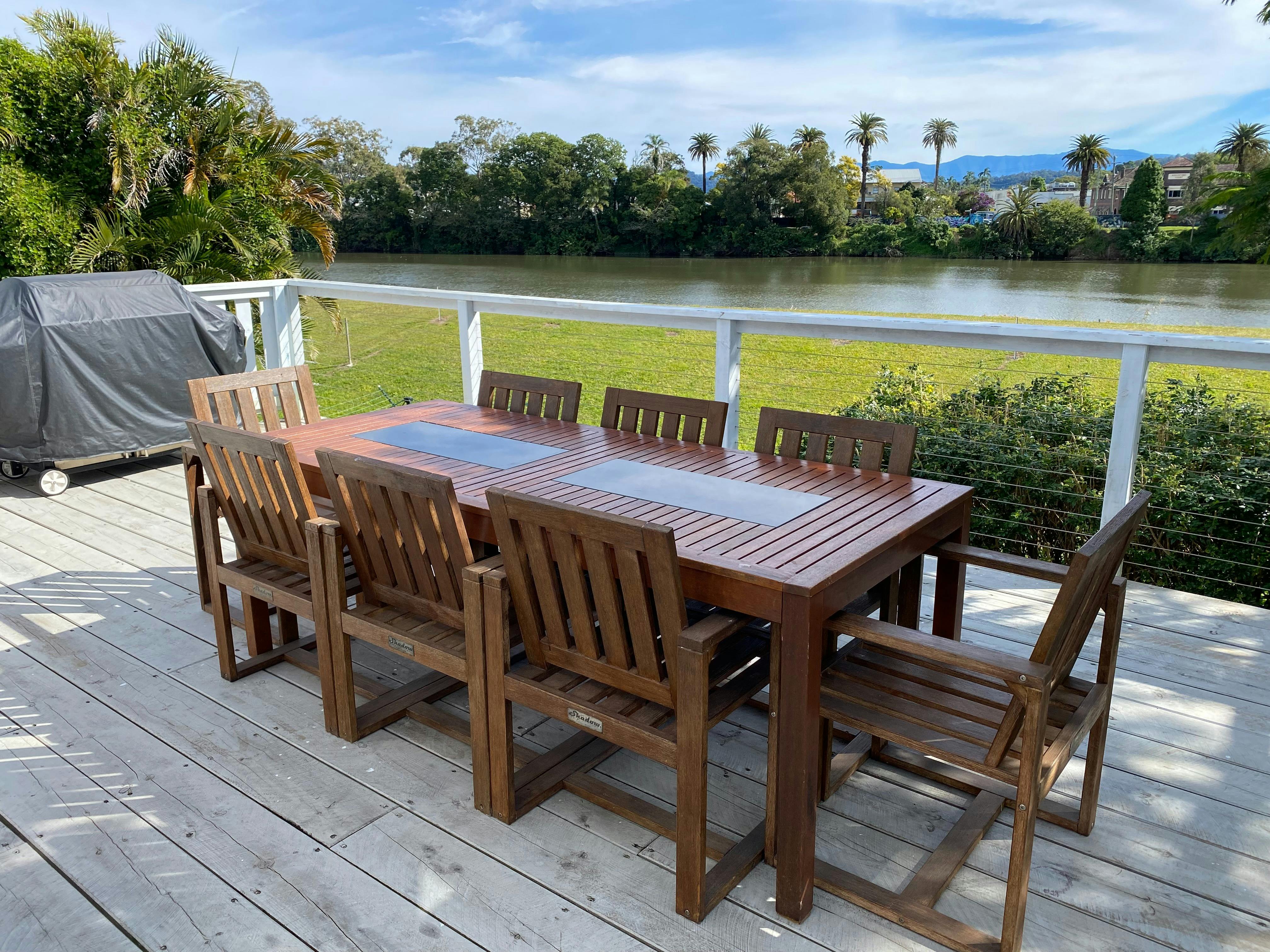 Outdoor patio with 8 seater table and BBQ