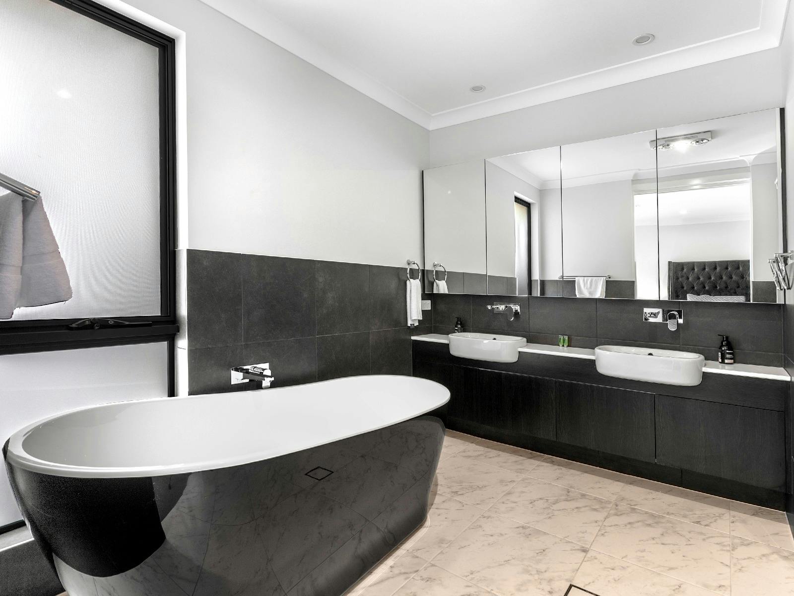 The Residence master bathroom with bathtub