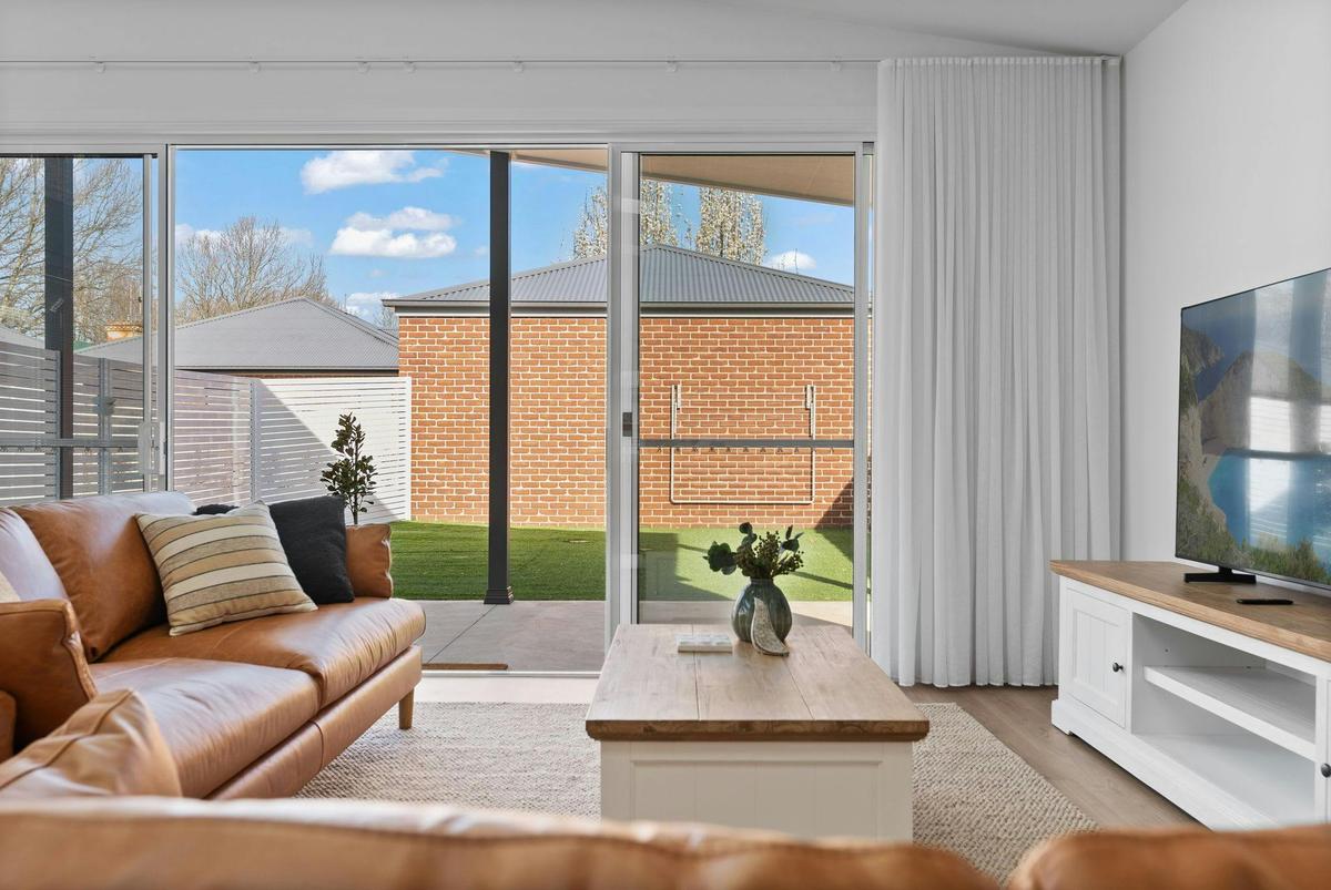 Living room window/doors looking out to the backyard of Stunning Seymour