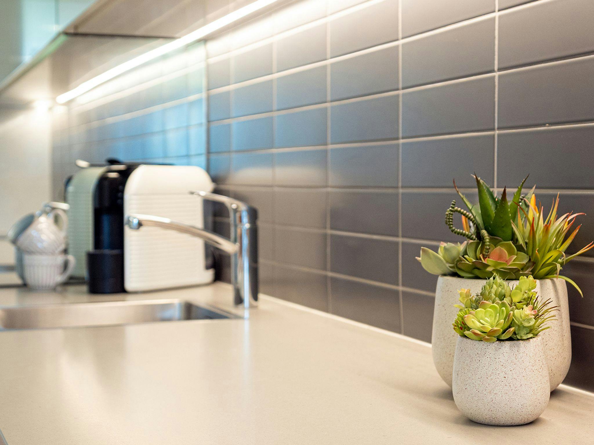 Surf N Turf | Downstairs full kitchenette | Coffee pod machine 