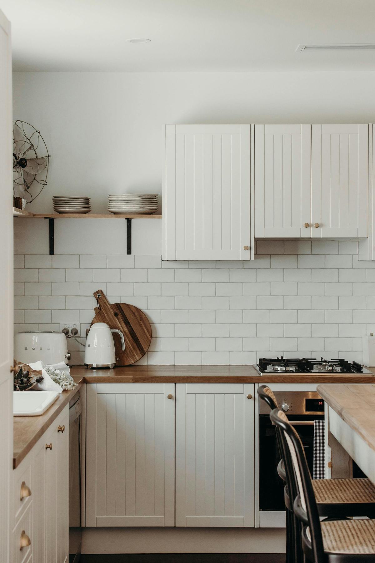 Cute country kitchen is fully equipped with Smeg toaster and kettle, gas stove, electric Bosch oven,
