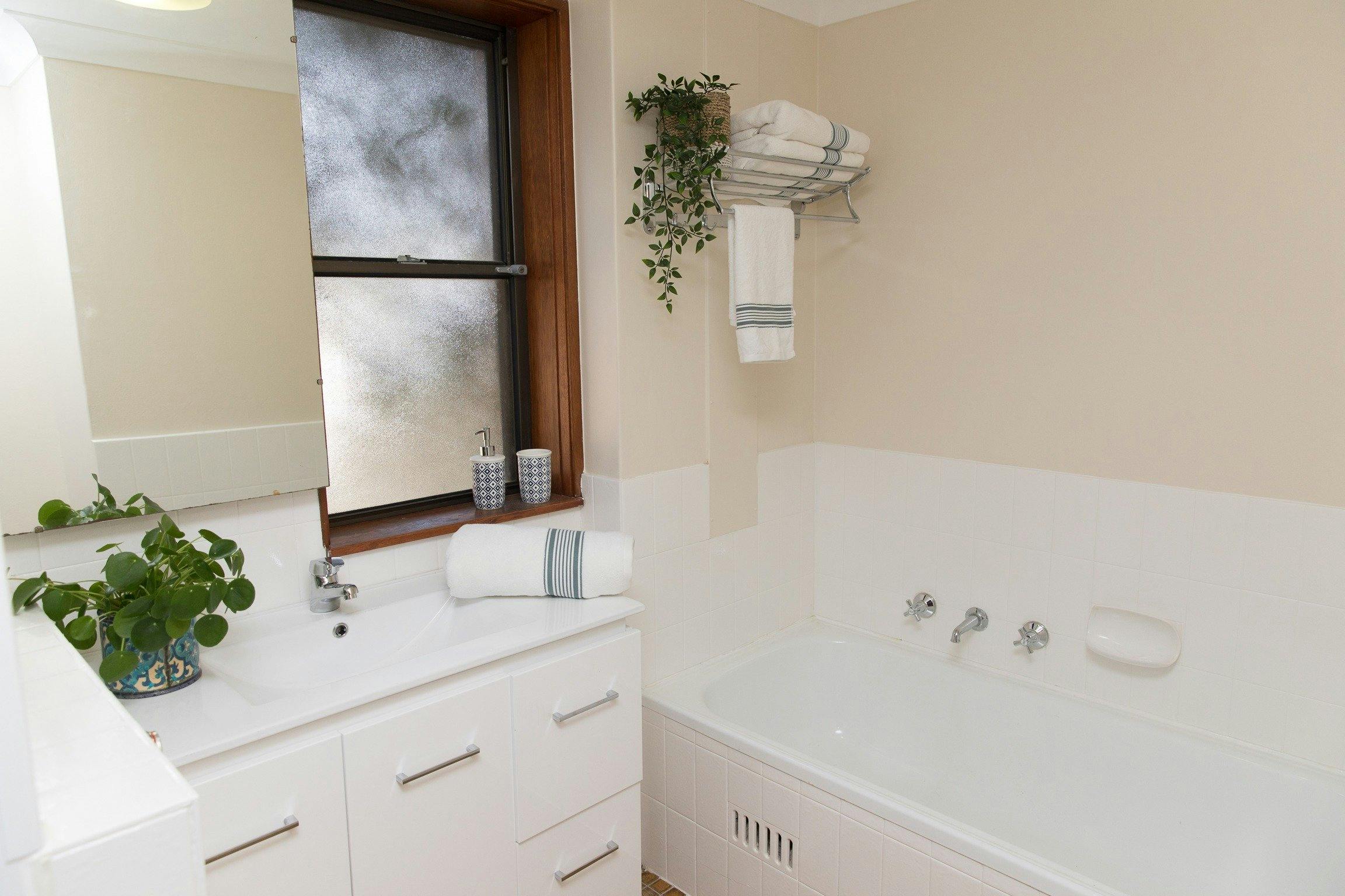 Taranaki Beach House | Opposite Town Beach - Main Bathroom
