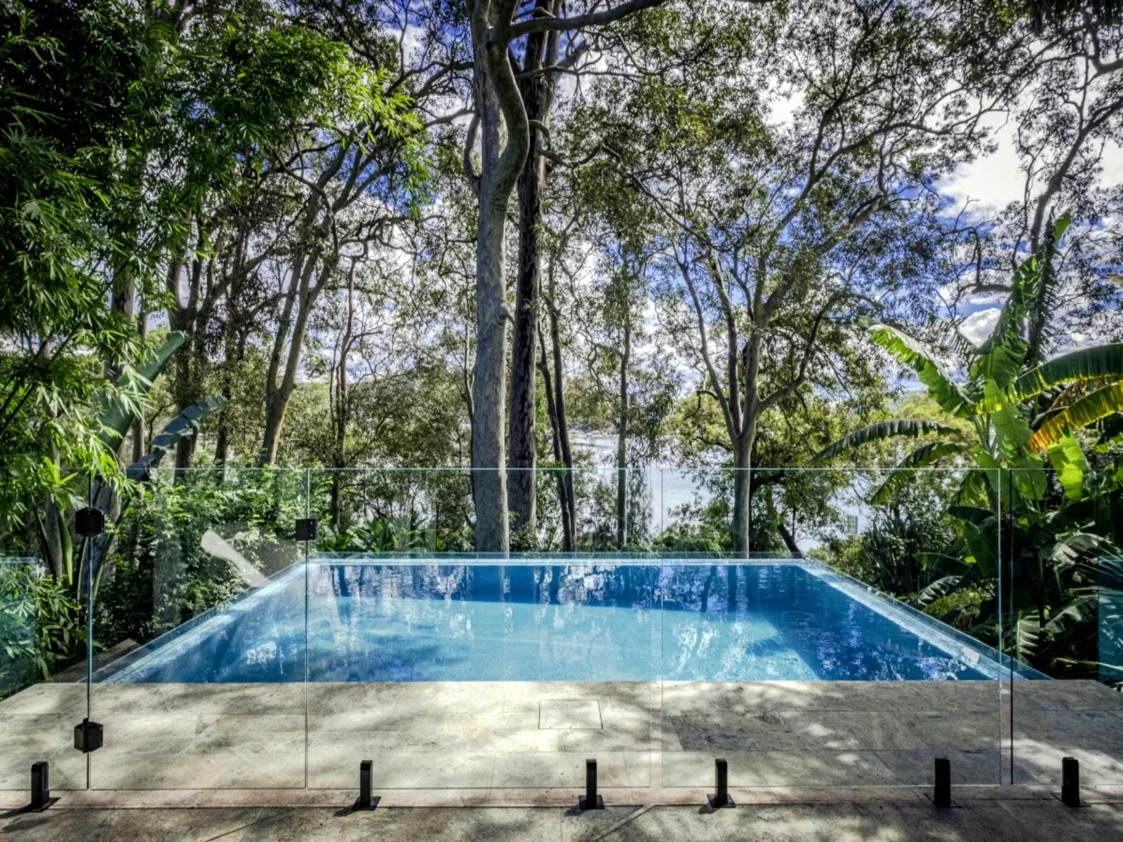 Stunning swimming pool with lush greenery