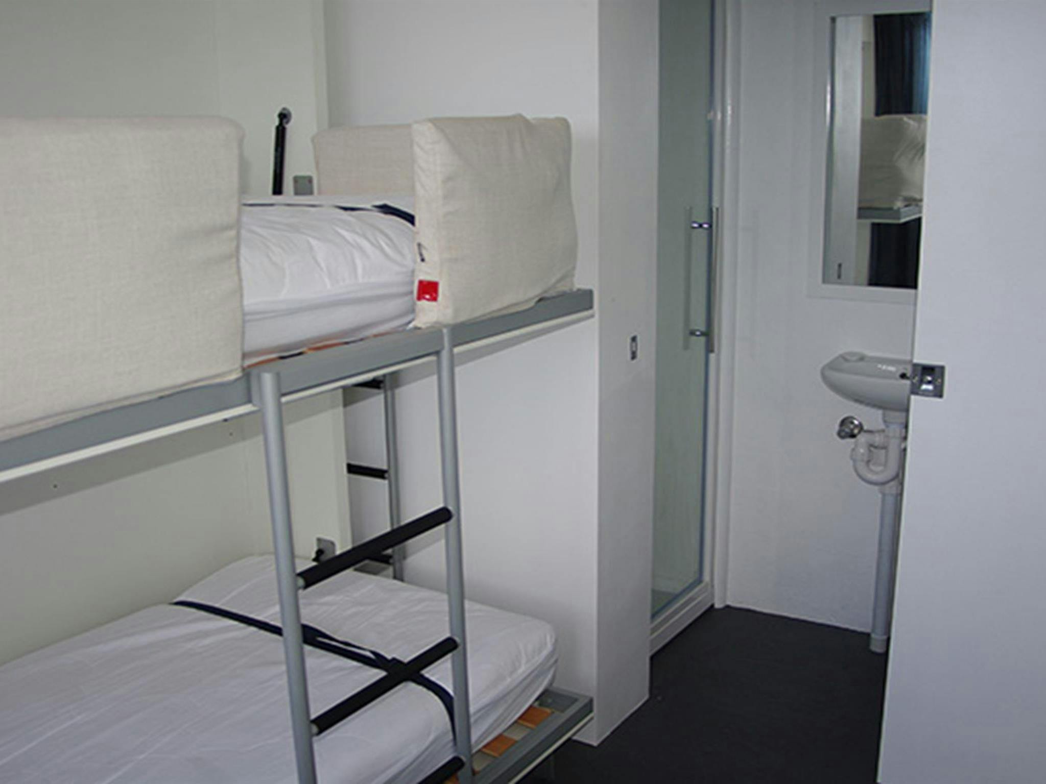 Bedroom and bathroom in Telegraph Station bunkhouse, Beowa National Park. Photo: Gary Mullinger/OEH