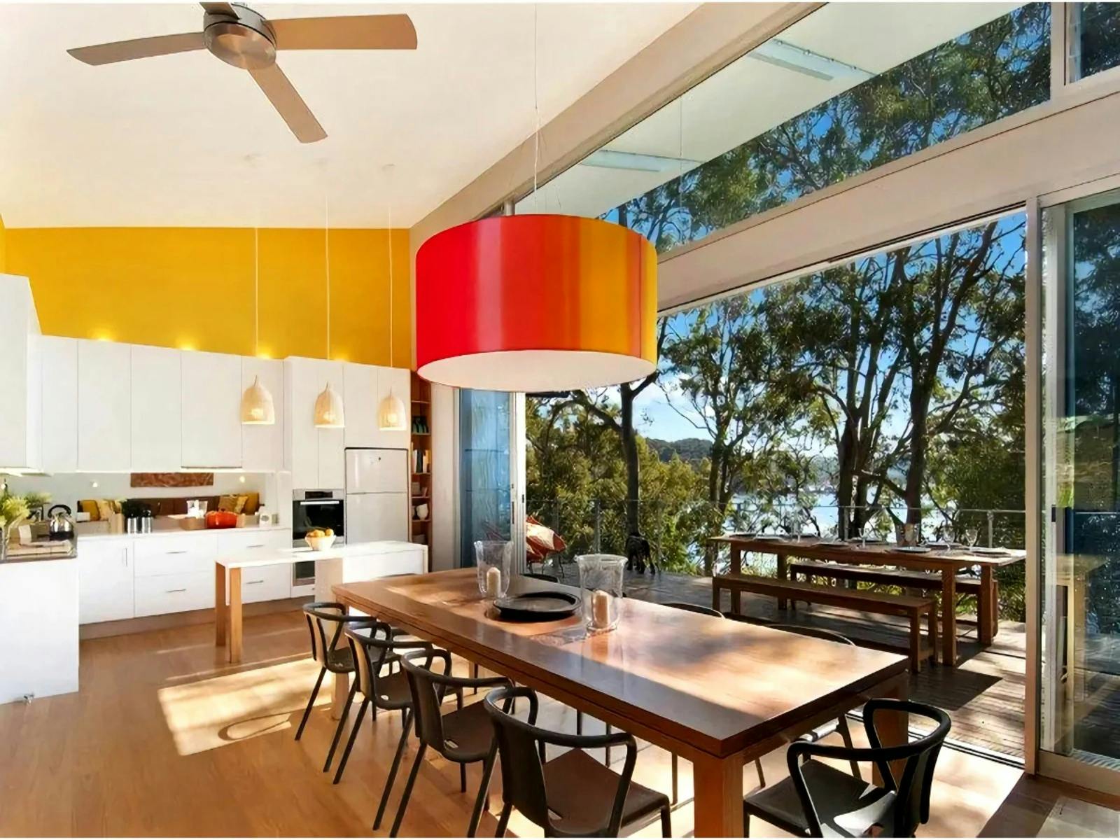 Open plan dining and kitchen area with water views