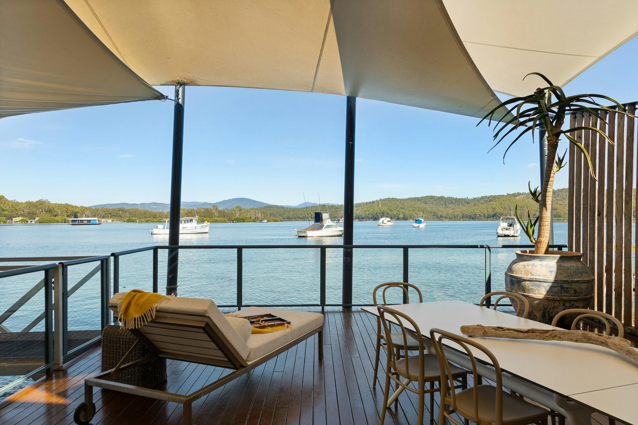 Loungers and dining on the deck with sensational over-water tranquility