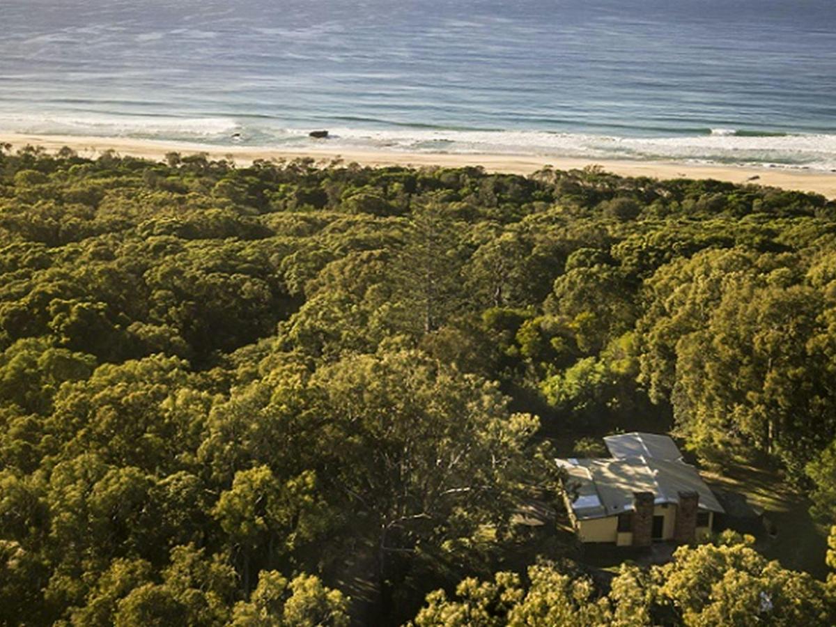 Aerial view of Tuckers Rocks Cottage and bushland and beach surrounds. Photo: John Spencer/DPIE