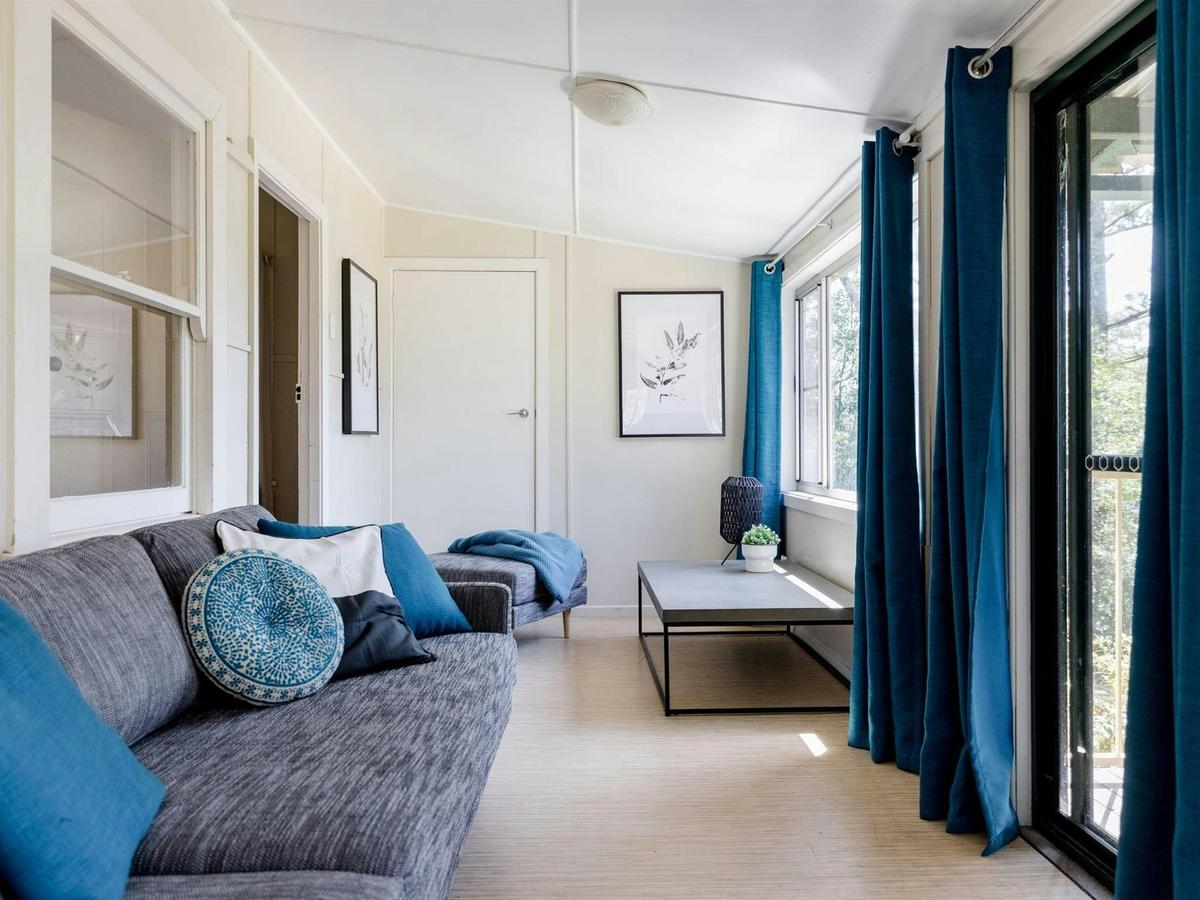 The sunroom with sofa bed in Tuckers Rocks Cottage, Bongil Bongil National Park. Photo: Mitchell