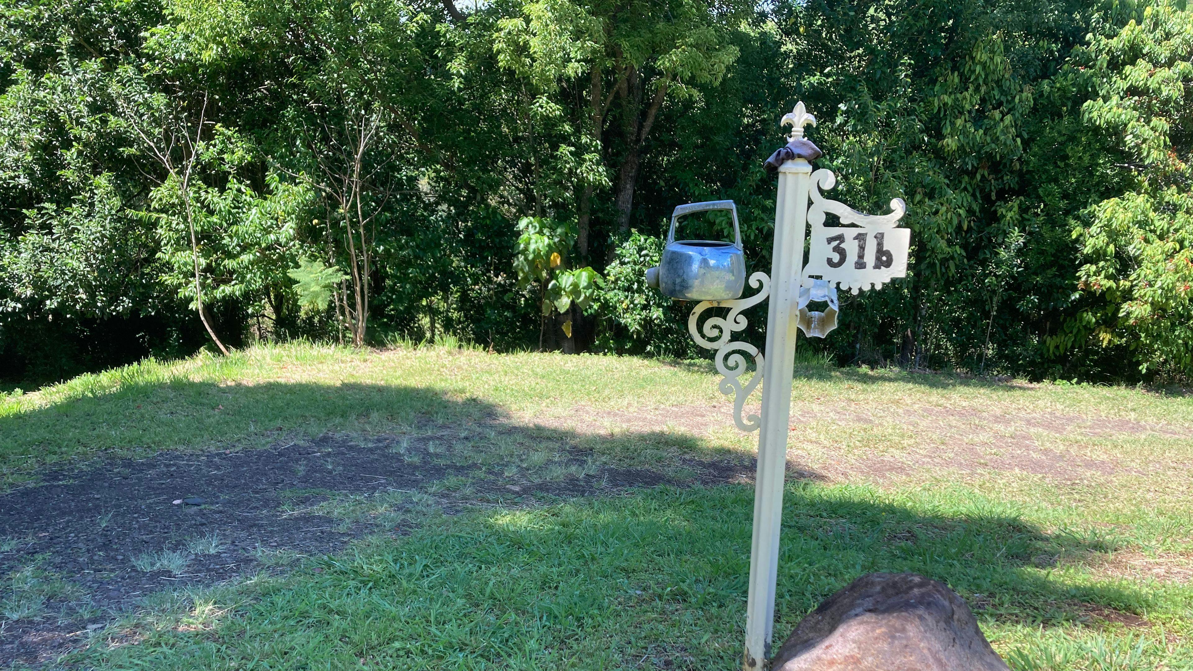 Look for this sign 700m up the dirt road. It goes down and to the right, with road-base and drainage for all-weather access. 