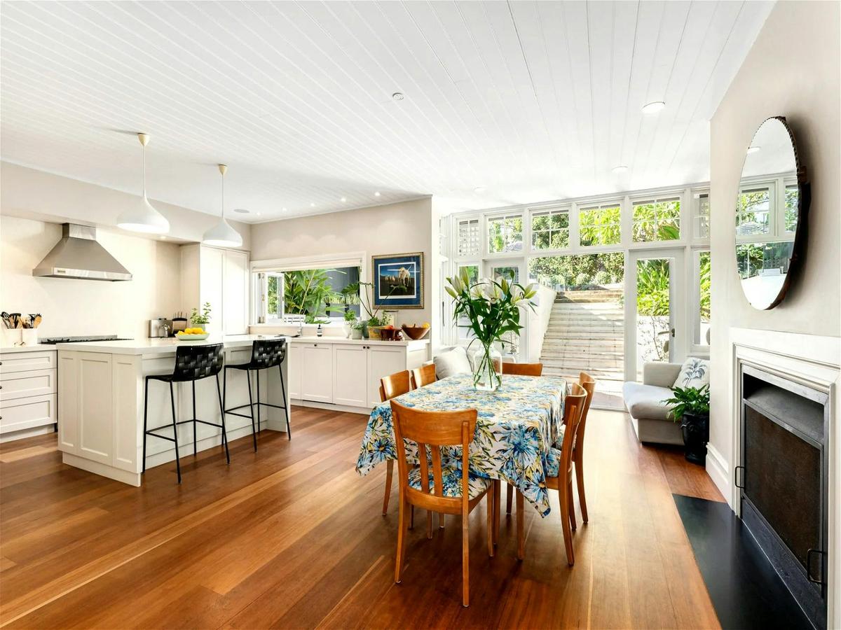 the oversized immaculate kitchen, adjacent to the dining room and living room