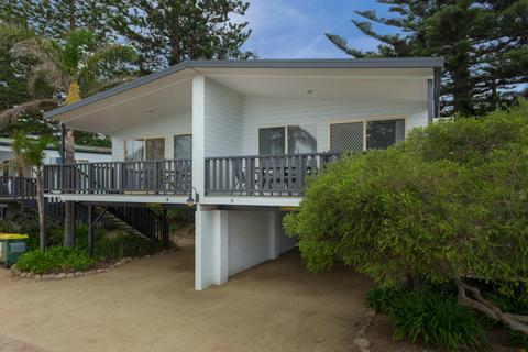 Elevated, 2 bedroom self contained Holiday Unit with partial beach views.