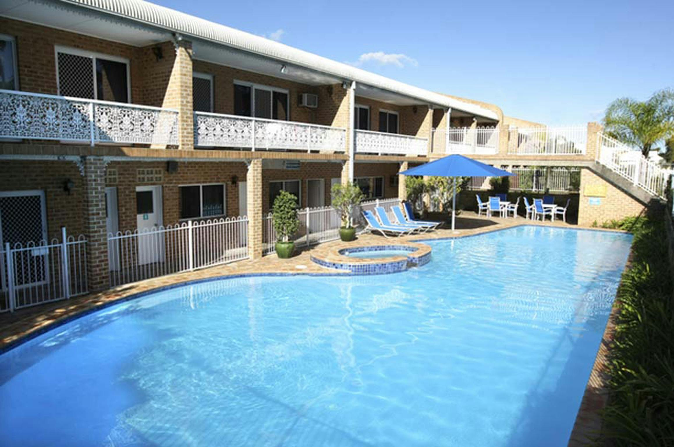 Motel rooms overlook pool