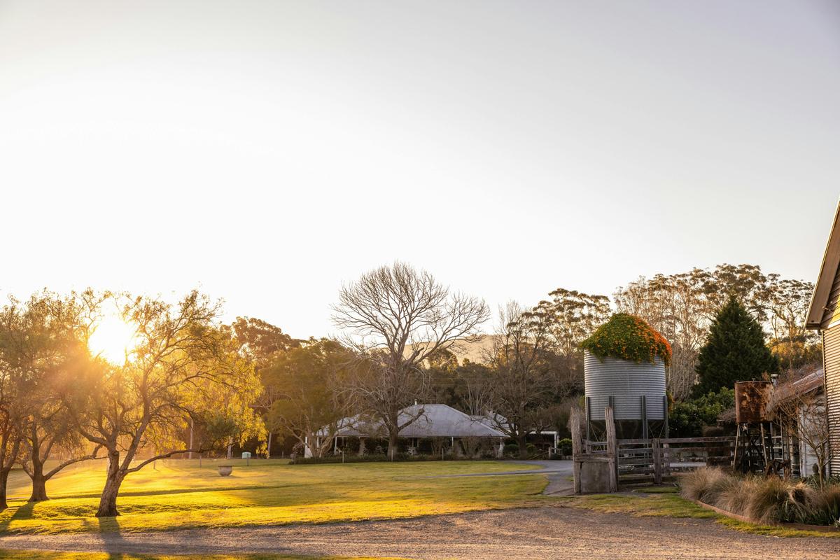Sunset over the farmhouse and silo
