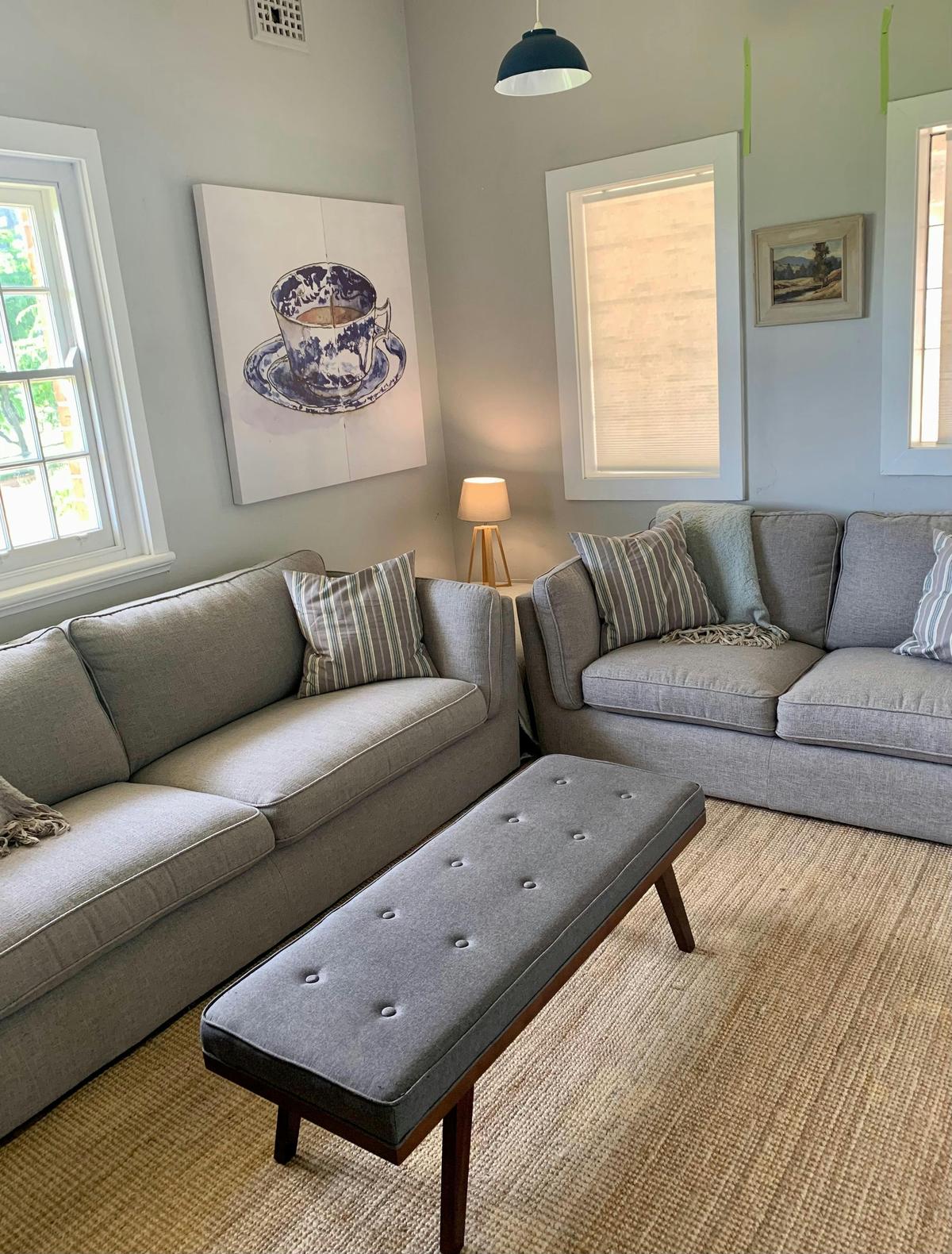 The tv room has comfortable sofas and  65 inch tv with Apple TV connectivity