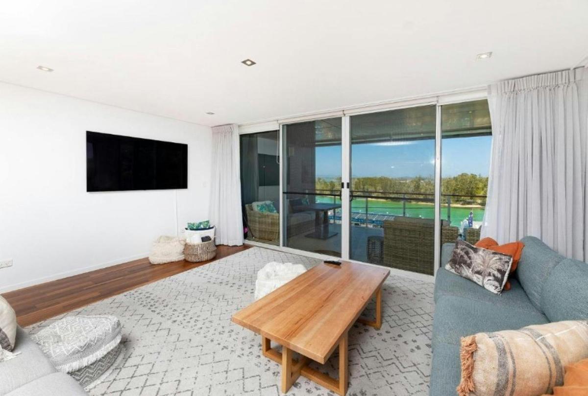 Lounge area with lake views, leading out to balcony