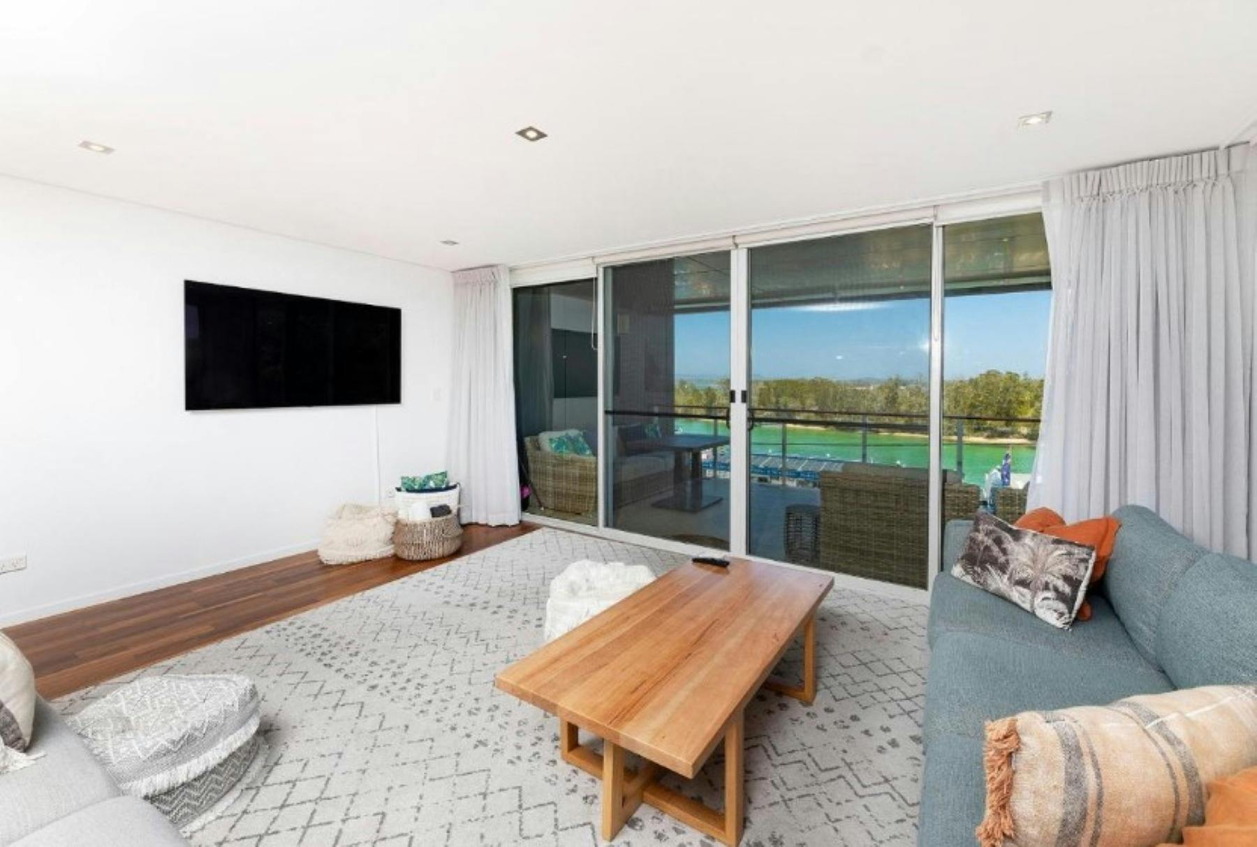 Lounge area with lake views, leading out to balcony