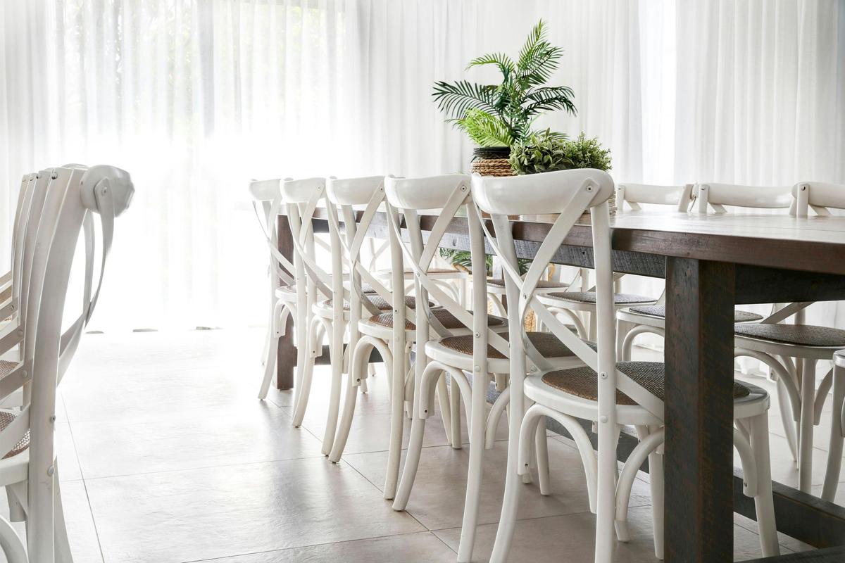 Dining room with 2 bespoke timber dining tables. Seats 32 people comfortably .
