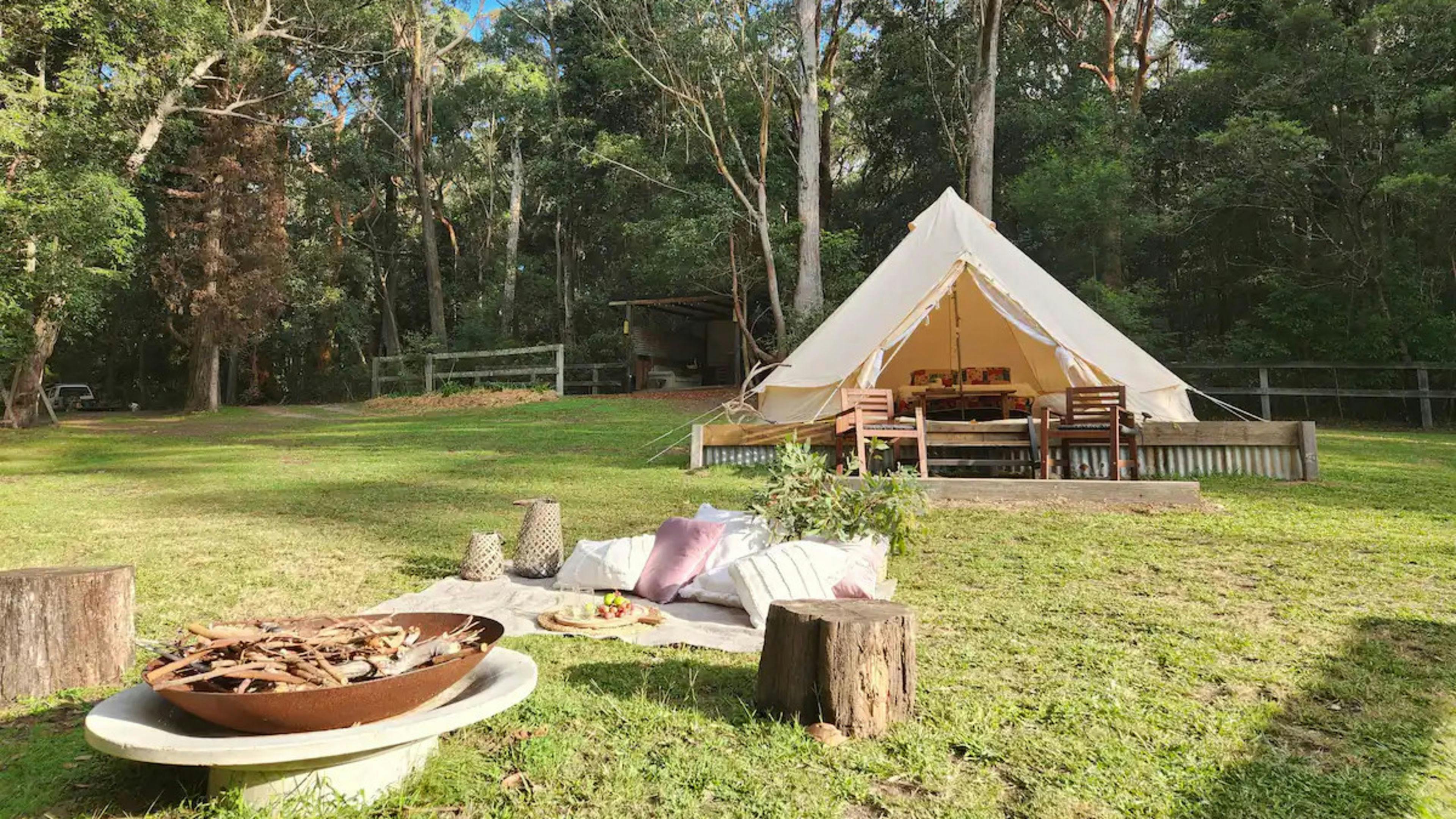 Where the Glamping tent is located. Kitchen sheltered area in background and fire-pit in foreground. 