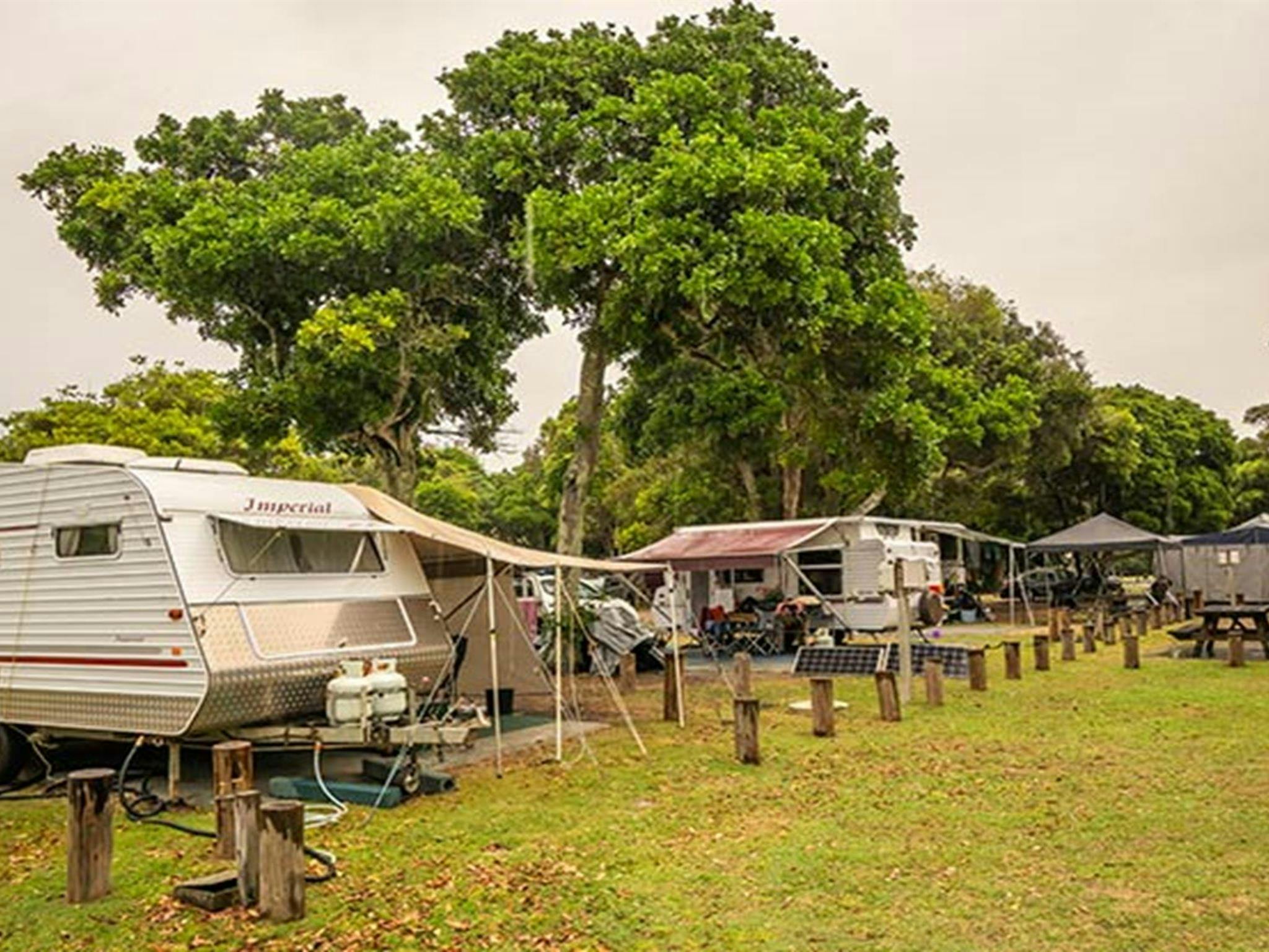 Two caravans set up for a holiday at Woody Head campground, Bundjalung National Park. Photo: John