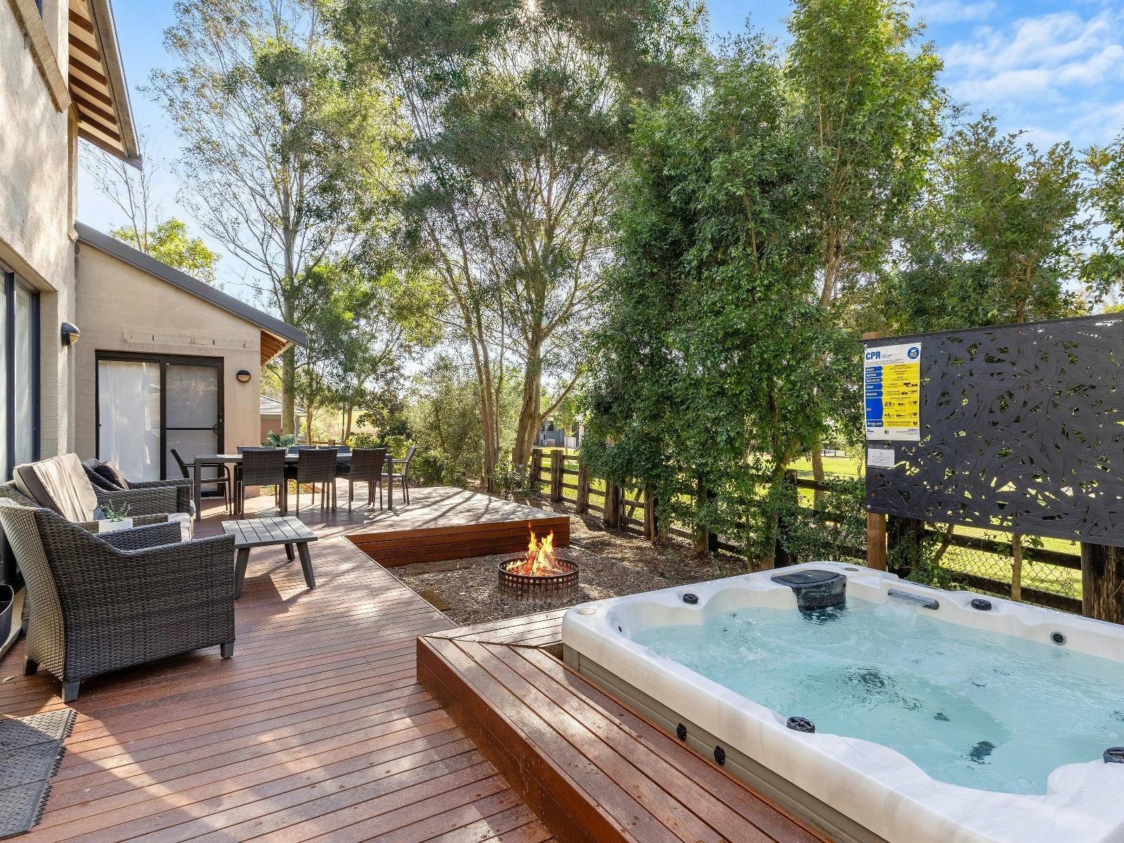 Wine Down outdoor deck area with firepit and spa