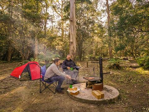 Friends cooking lunch on hot plate at Thungutti campground. Photo: John Spencer/OEH