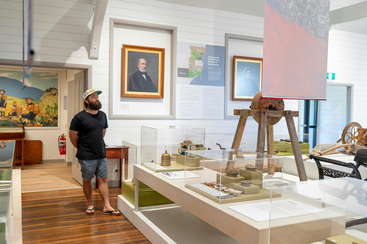 A man looking at historical objects.