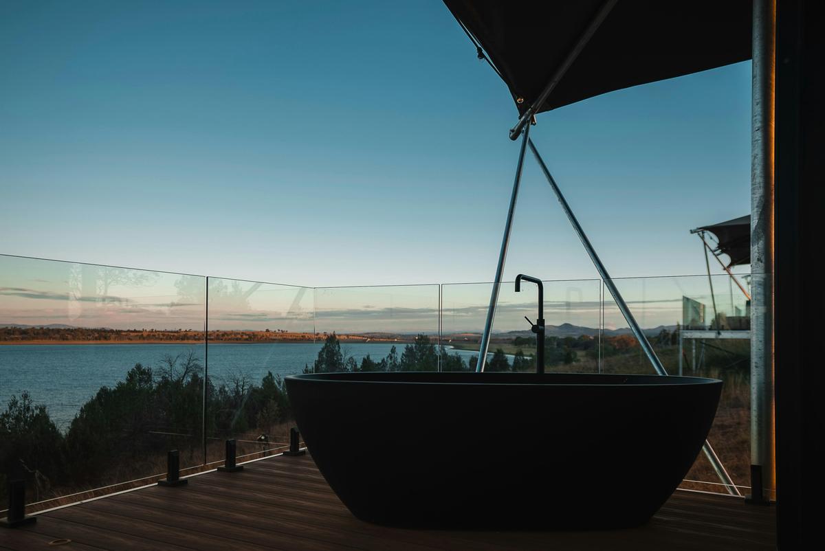Wilderluxe star tents bath on the deck