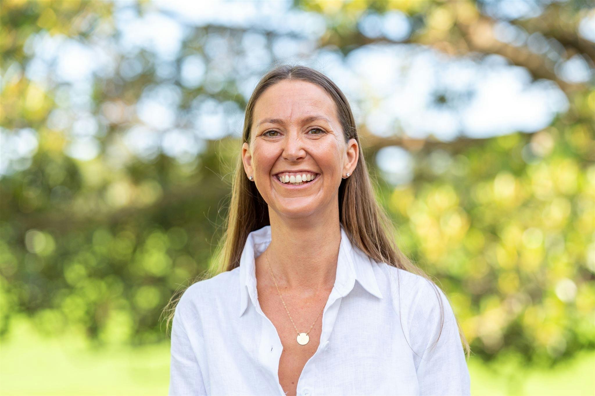 Photo of Kate Cliff with nature background