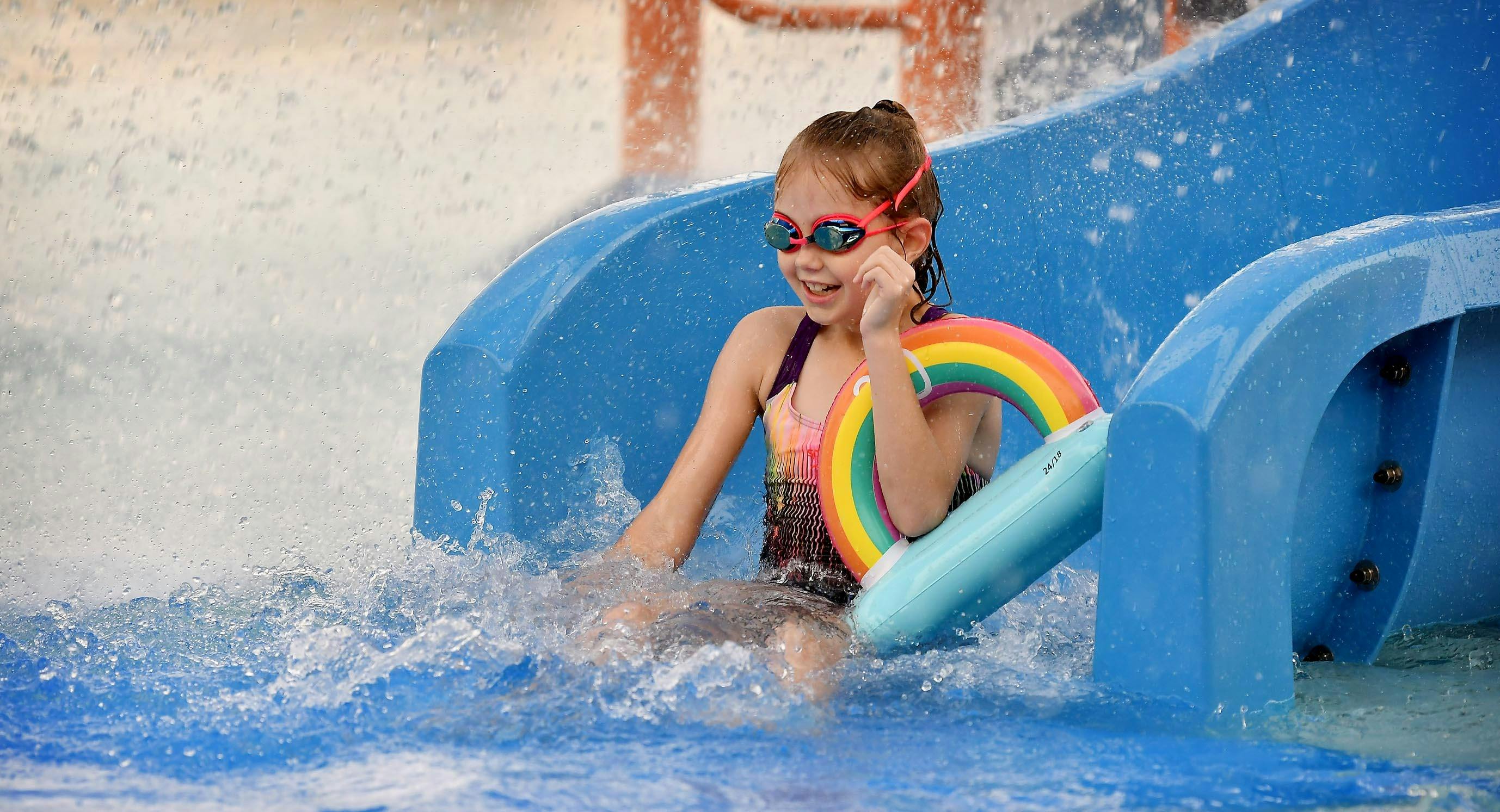 Child enjoying waterslide at Gunnedah Pool