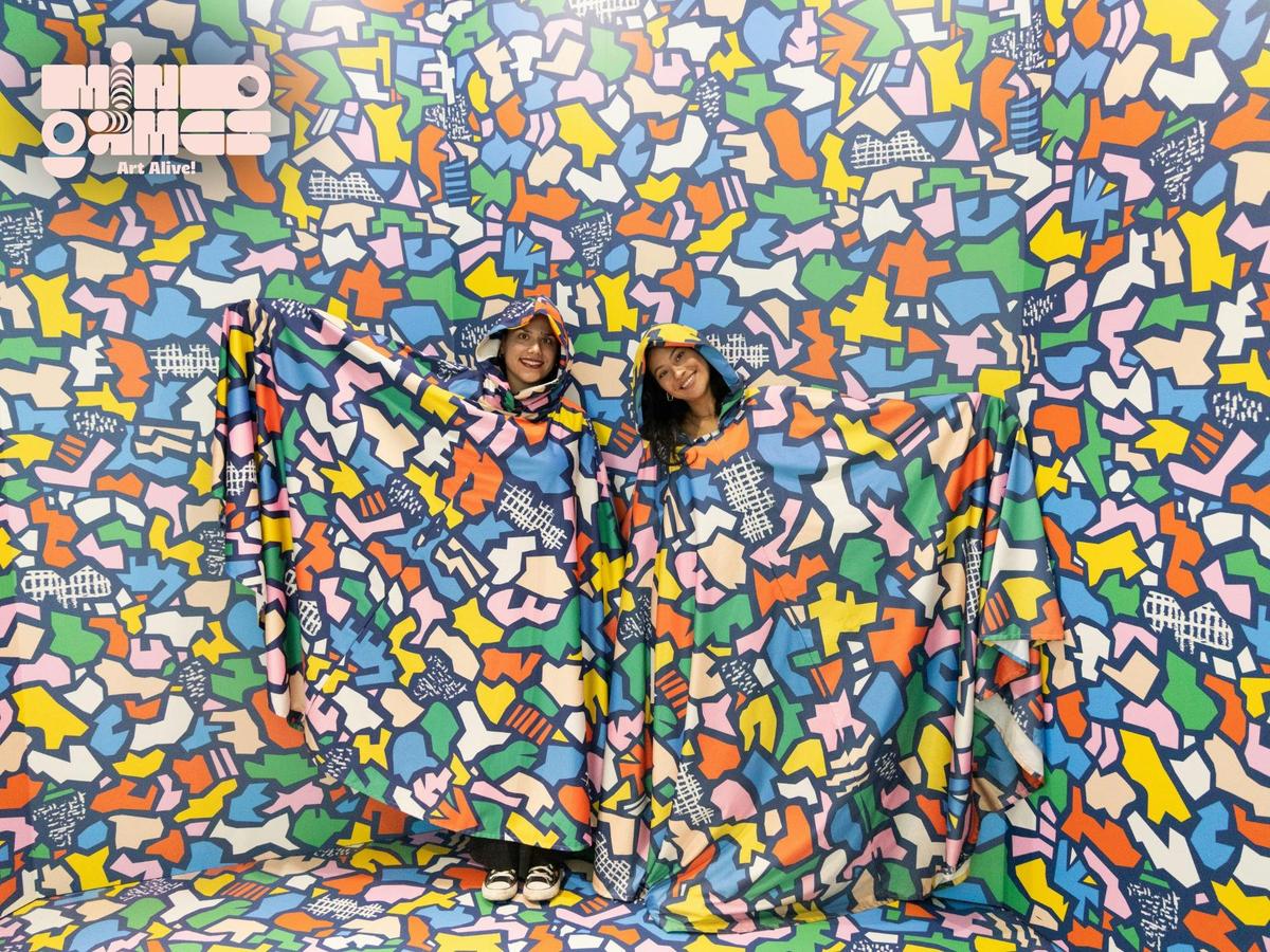 Visitors become part of the artwork in the Camouflage Room at Mind Games | Art Alive in Sydney.