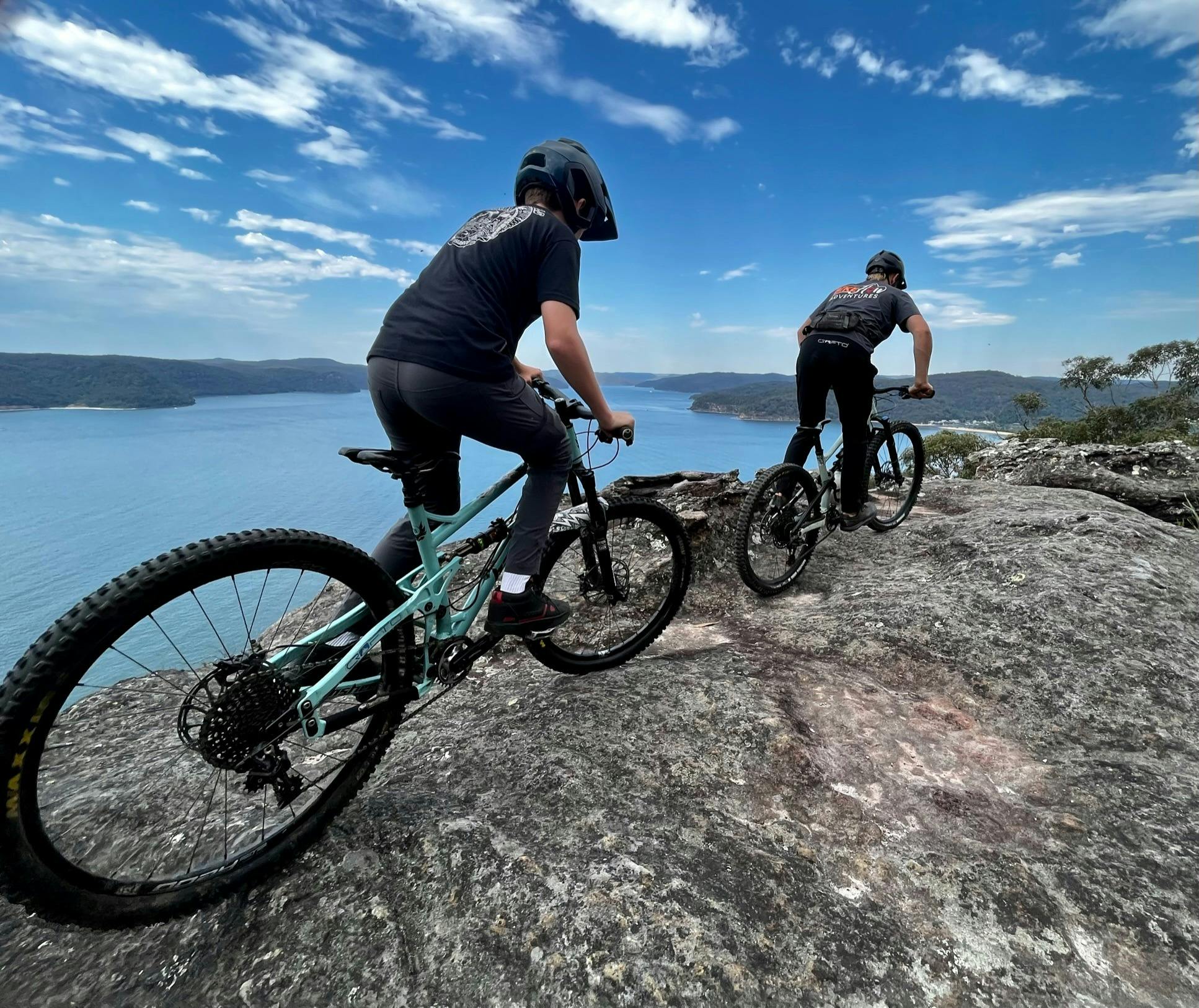 Mountain bikers on dramatic clifftop trail