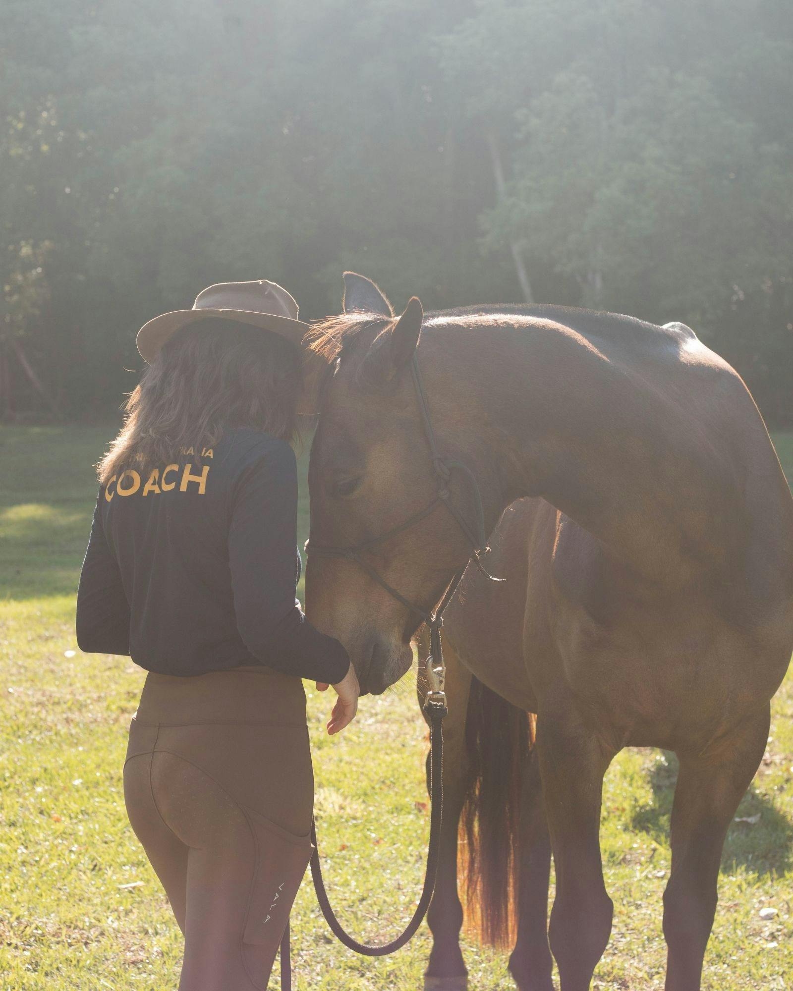 Hiddy sharing a quiet moment of trust and softness with one of our gentle horses.