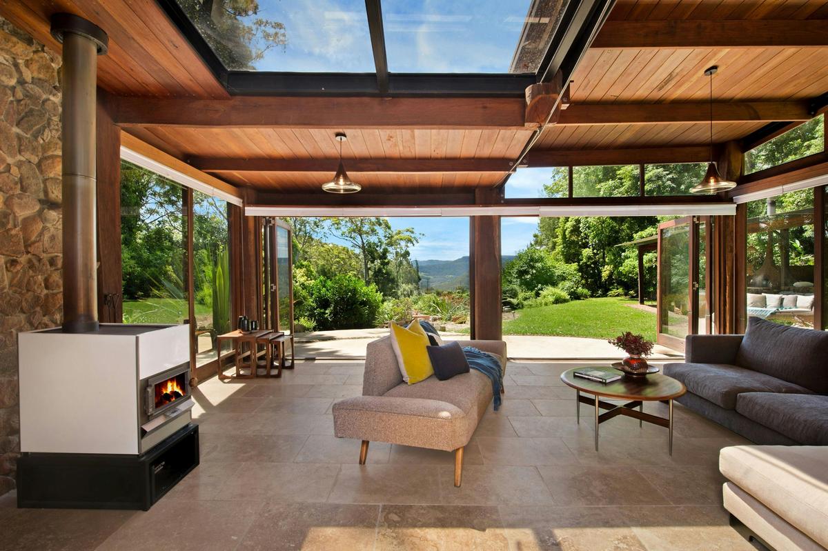 Living Room with combustion fireplace and view