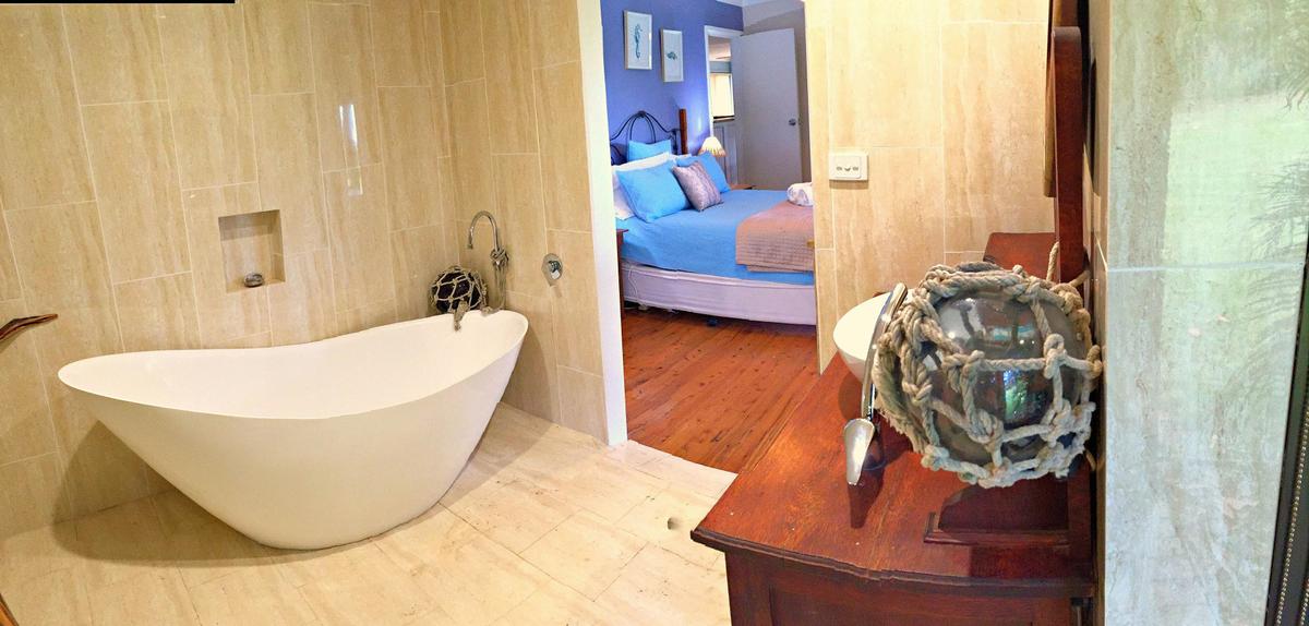 Driftwood and tile bathroom with vintage features