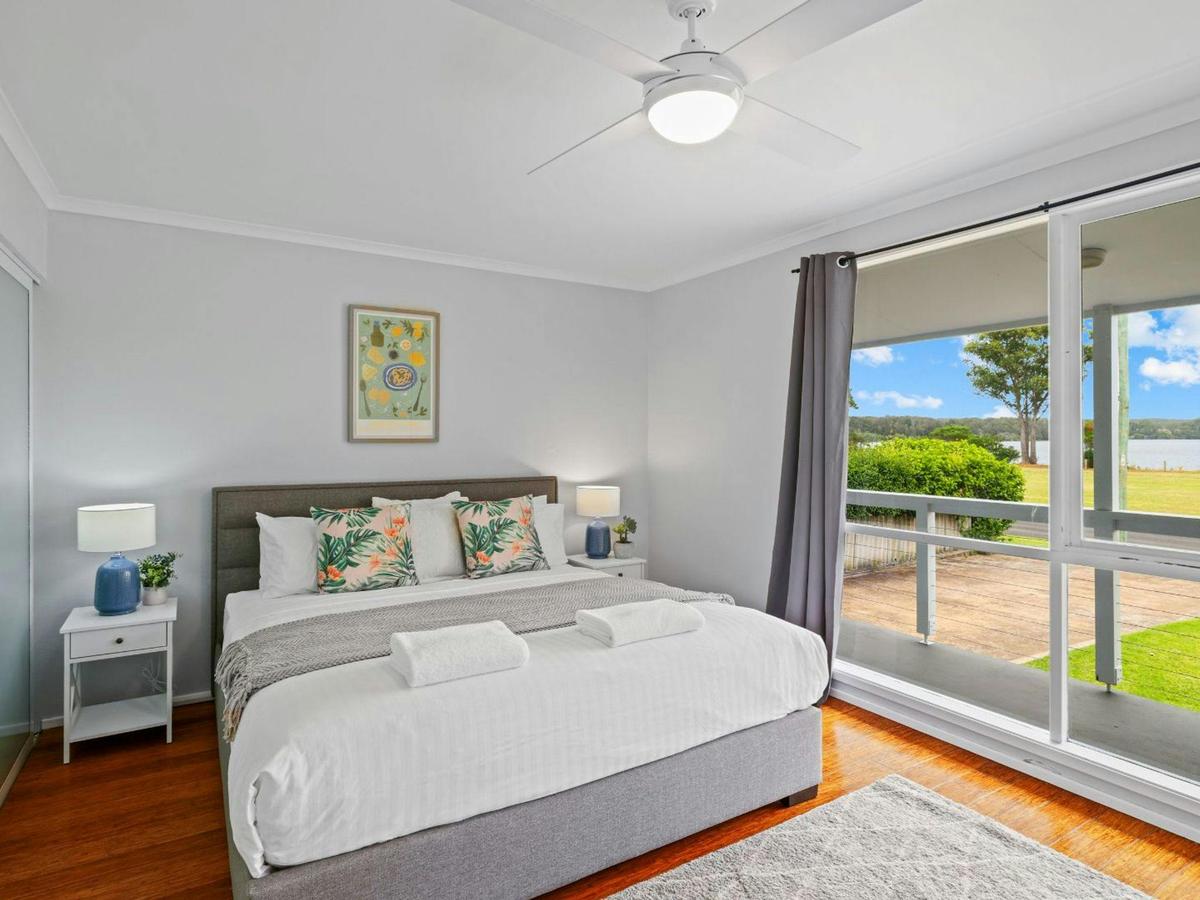 Riverside Retreat | Bedroom 1 | King | Ceiling fan | Ensuite | Travel cot |  Views