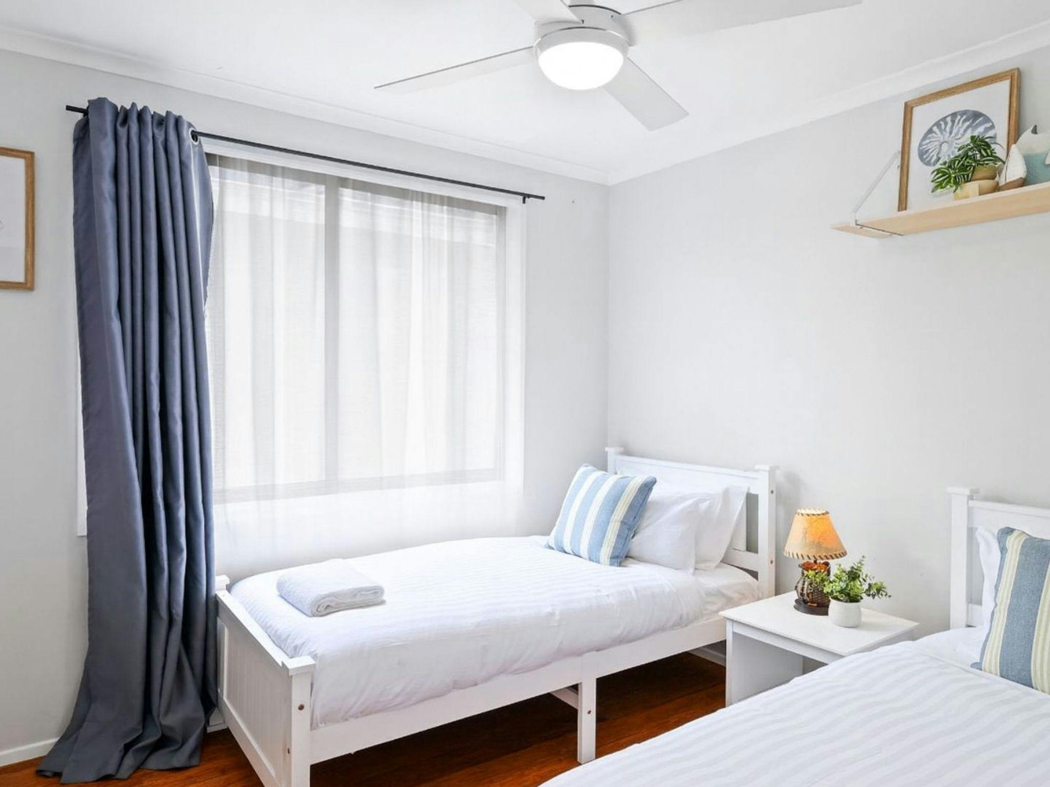 Riverside Retreat | Bedroom 2 | King singles | Ceiling fan 