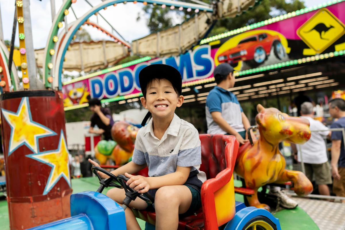boy on carnival ride