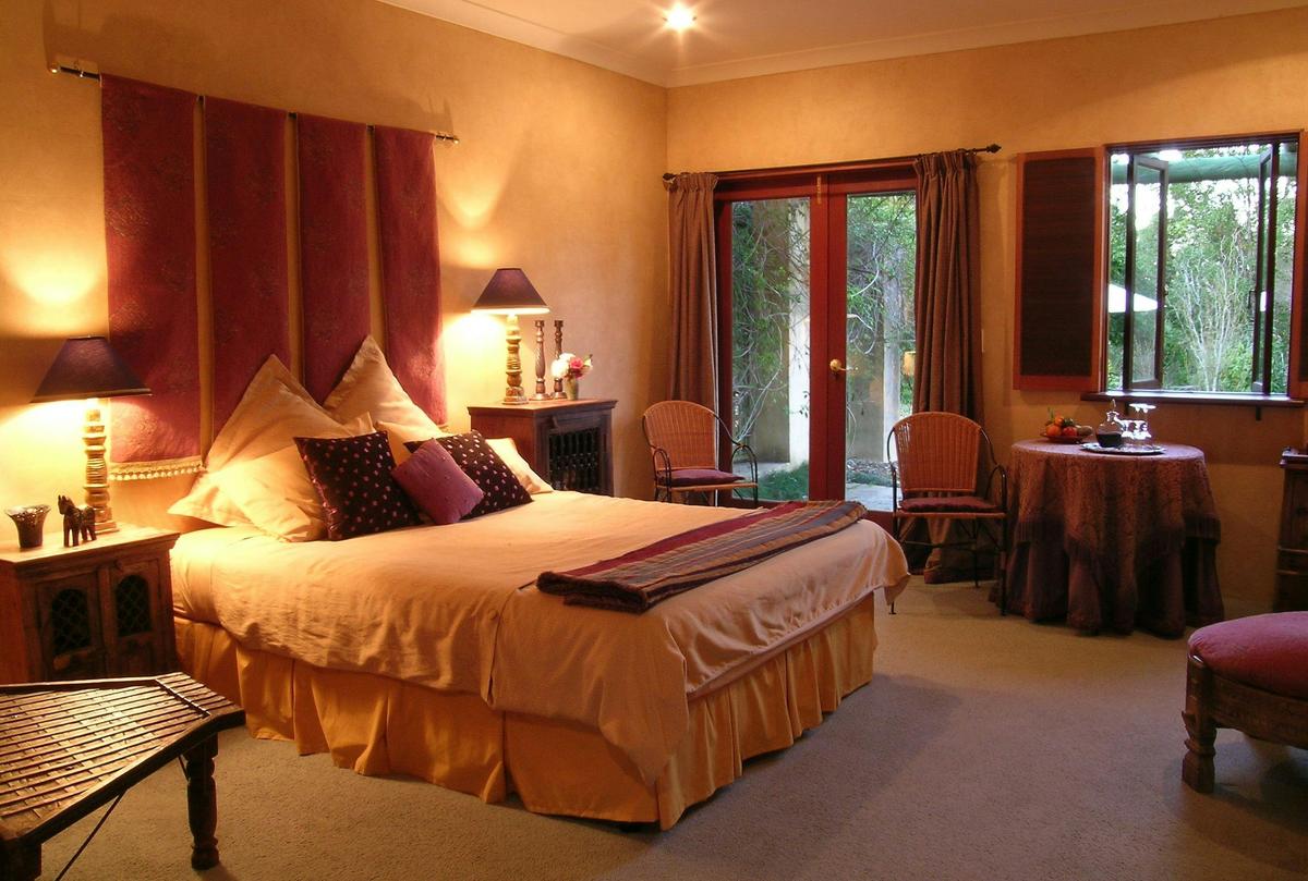 CasaBelle bedroom with French doors leading to private patio