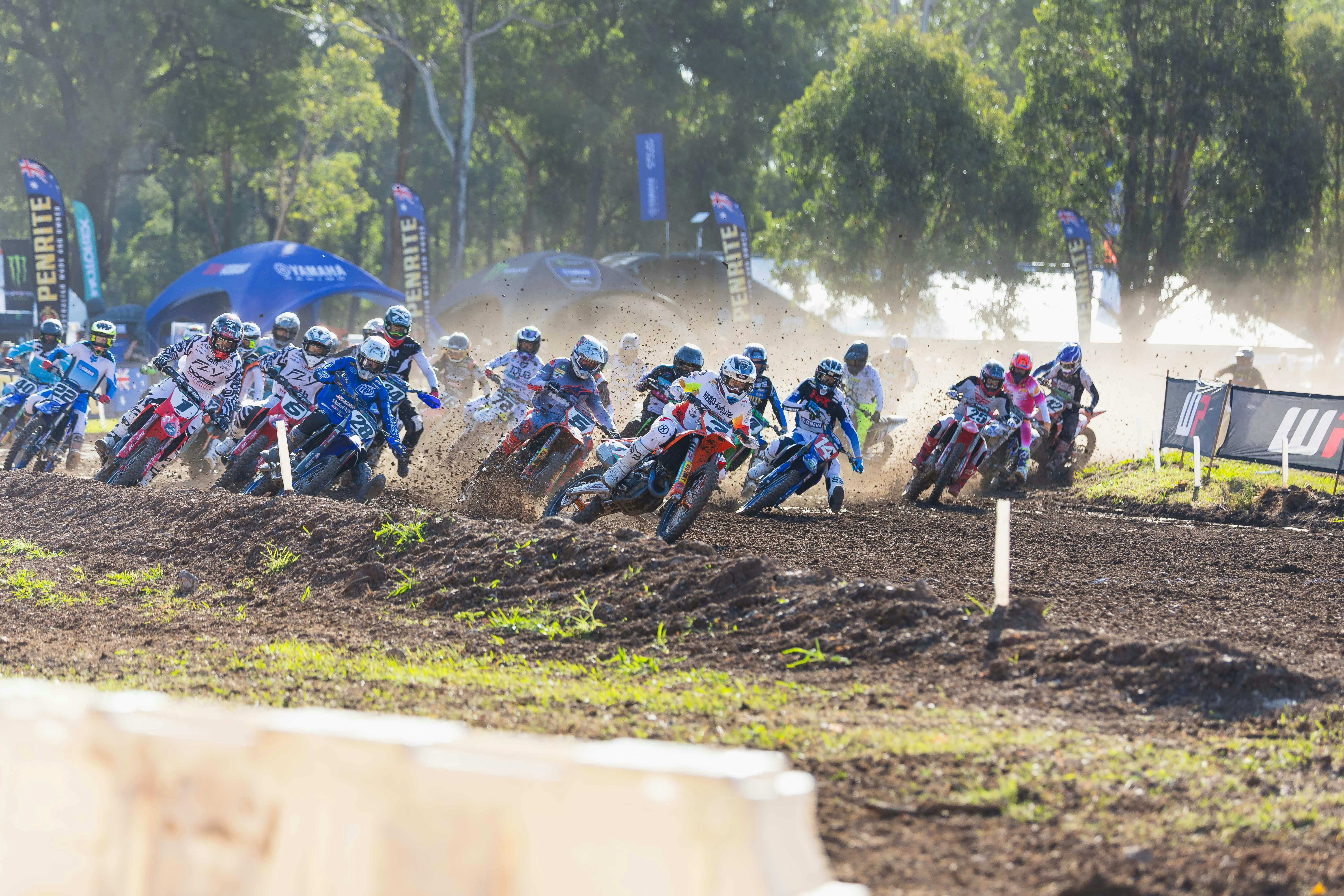 The MX1 Pack hurtles around turn 1