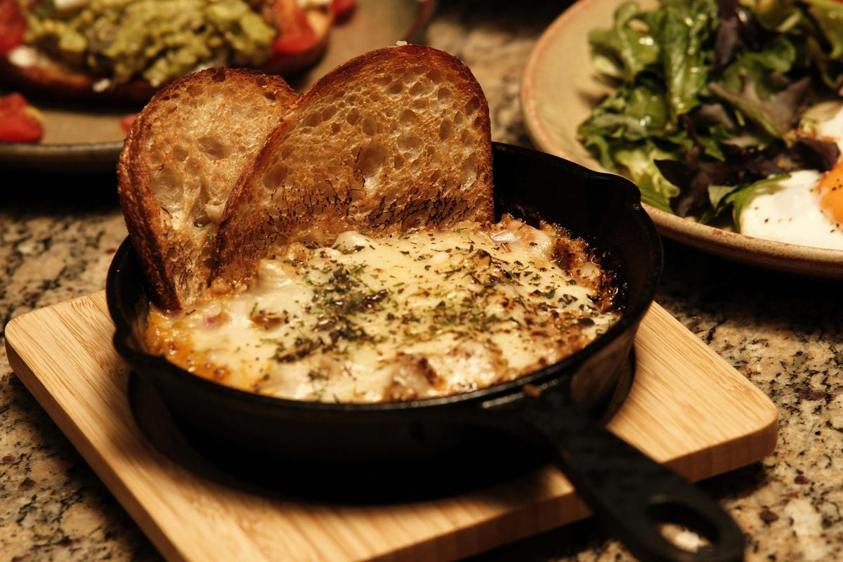 Hot dish with toast at Taguan